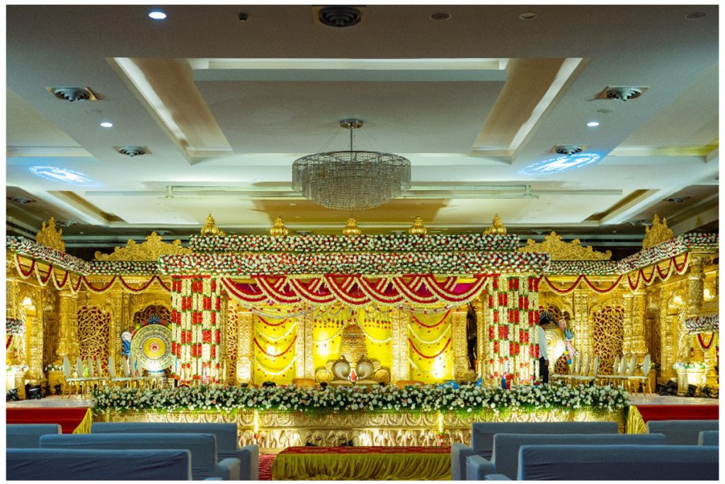 Best wedding stage decoration in Hyderabad at Ramoji Film City with grand floral and golden backdrop setup.